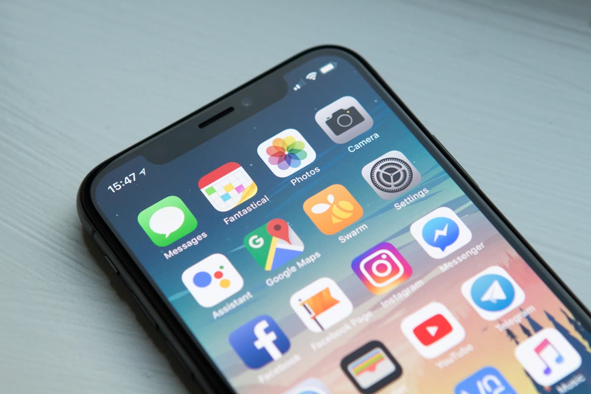 Smartphone showing messaging apps used for business conversations