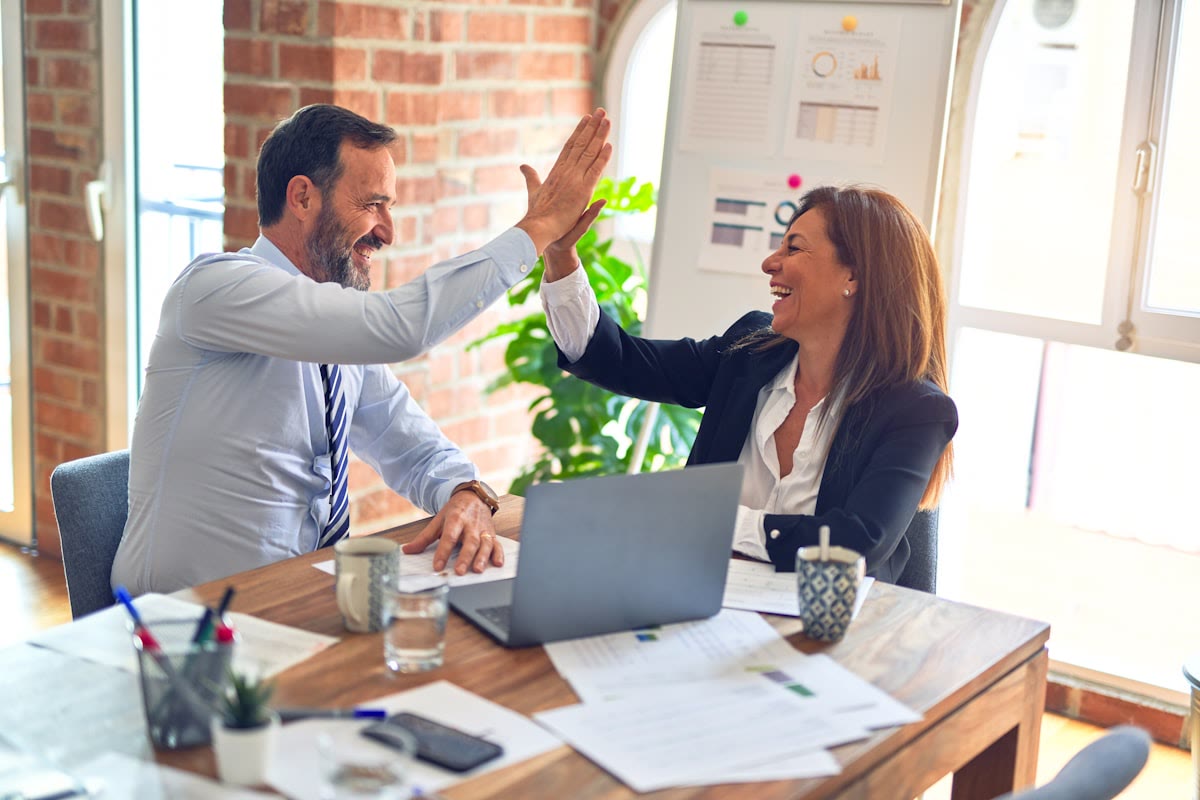 Sales team celebrating after switching WhatsApp CRM without losing pipeline